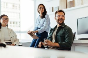 Professionals listening to a discussion in an office stock photo