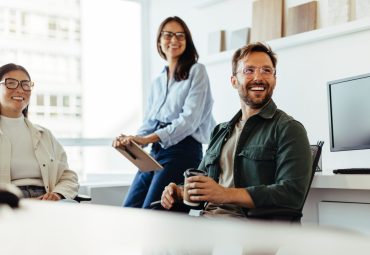 Professionals listening to a discussion in an office stock photo