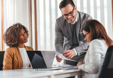 Team of lawyers checking documentation on the meeting with a client