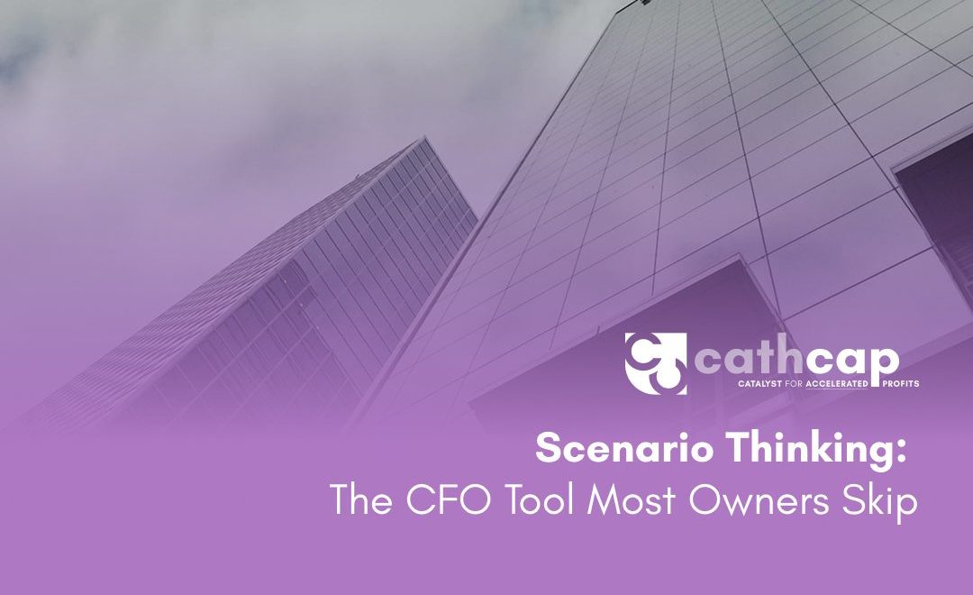 CFO reviewing a three-scenario planning framework with a business owner at a whiteboard