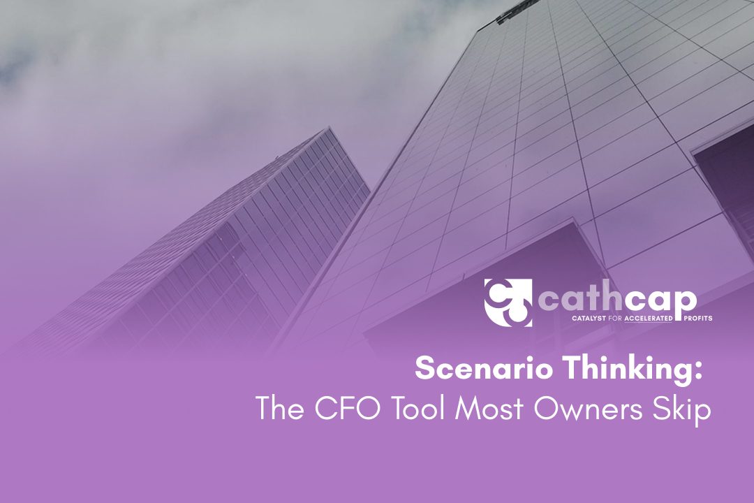 CFO reviewing a three-scenario planning framework with a business owner at a whiteboard