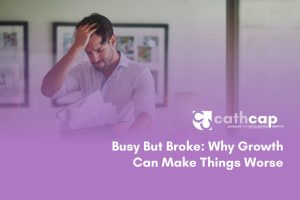 Business owner reviewing cash flow forecast for growing business