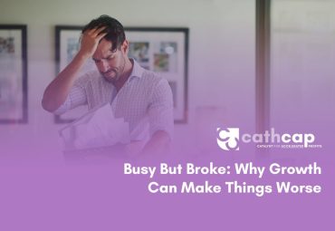 Business owner reviewing cash flow forecast for growing business