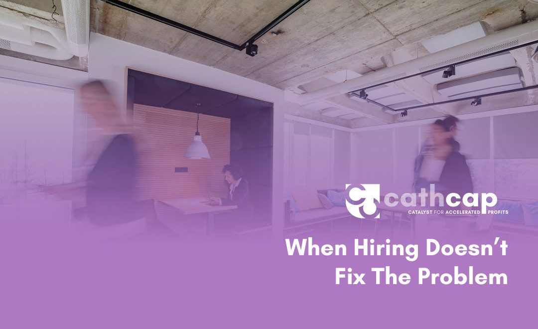 Law firm owner reviewing realization rate data and billing reports instead of posting a new job listing