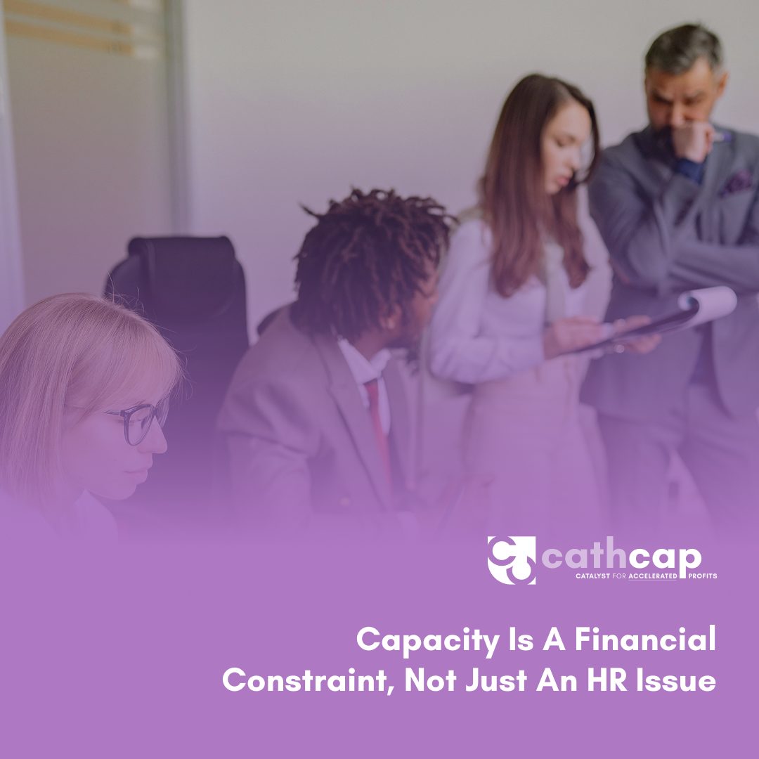 Law firm owner reviewing realization rate and cash runway data to determine profitable case capacity before hiring