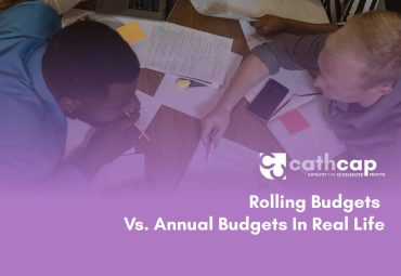 Law firm managing partner reviewing a mid-year rolling budget update showing Q3 cash projections based on current collections and lockup