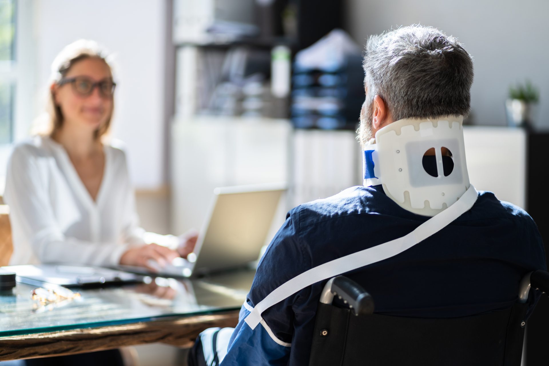 personal injury lawyer talking with client