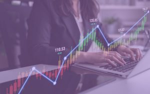How Proper Forecasting Helps Grow Your Law Firm heading person working on computer forecasting numbers